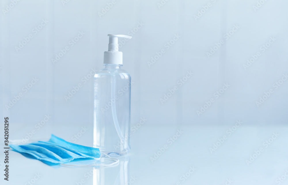 Coronavirus prevention, bottle of hand sanitizer for hand hygiene corona virus protection and medical protective masks on white background. Coronavirus prevention, bottle of hand sanitizer for hand hygiene corona virus protection and medical protective masks on white background.