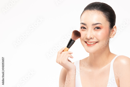 Beauty asian woman brown hair looking smile in camera happiness and hold make up brush and cheerful with make up brush,Beauty Concept on white background.