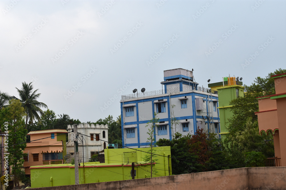 Traditional Indian small city scenery. Cityscape of Jhargram, in West Bengal. cityscape skyline of small city located on evergreen forest. Traditional Indian small city scenery. Cityscape of Jhargram, in West Bengal. cityscape skyline of small city located on evergreen forest.