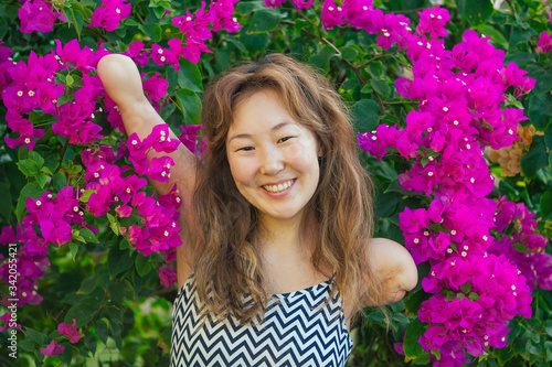 Slika na platnu happy asian armless woman smilimg at the tropical beach