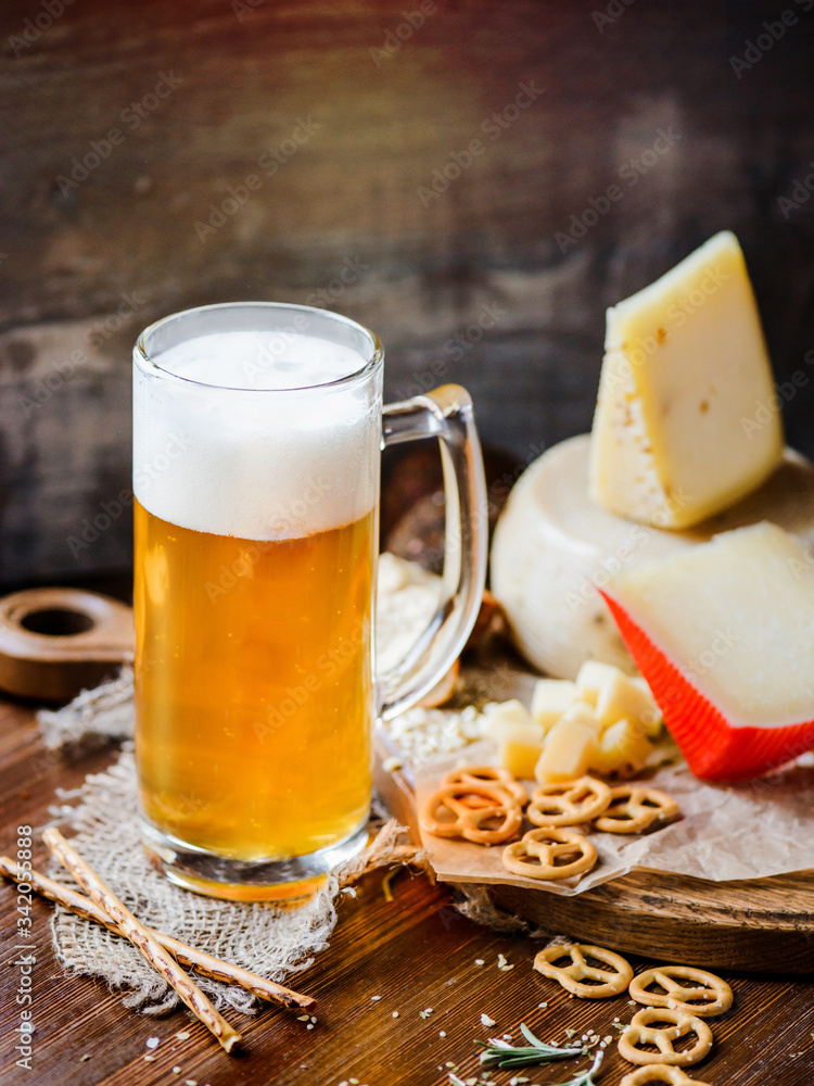 Pint of Beer with different snack and cheese Pint of Beer with different snack and cheese