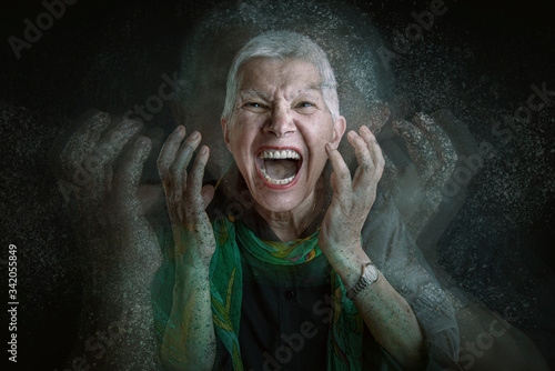 Portrait of old women, she becoming crazy and angry, dispersion motion photo