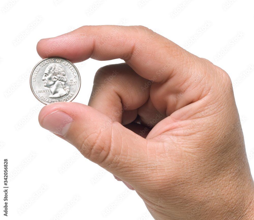 A hand holding a quarter dollar coin with two fingers, isolated over a white background. A hand holding a quarter dollar coin with two fingers, isolated over a white background.