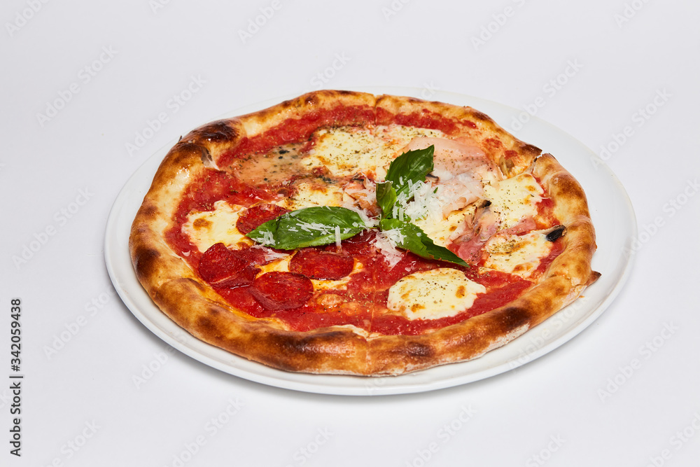 A pizza sitting on top of a white plate