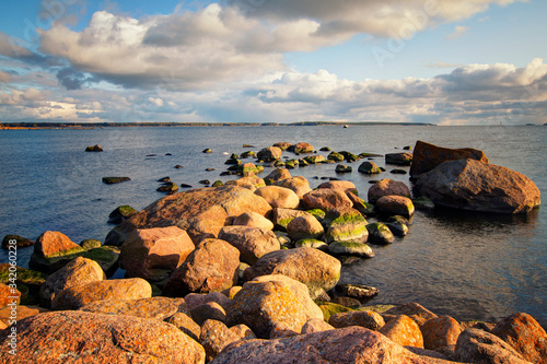 Katariina Seaside Park, Kotka, Finland. View of the Gulf of Finland from the park, sunset. Beautiful stones on the shore