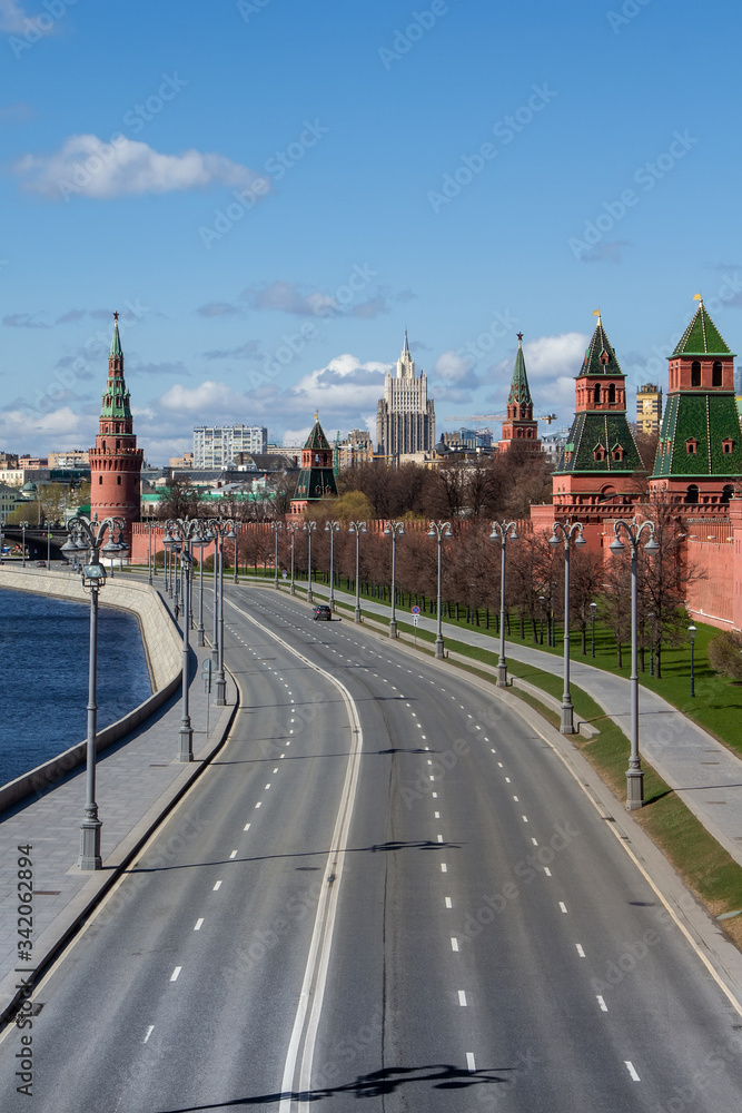 Fototapeta premium Covid-19, quarantine in Moscow, coronavirus in Russia. Empty streets without people. Self-quarantine in deserted city due to Covid virus pandemic. Kremlin embankment