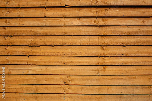 Orange colored fence made of wood