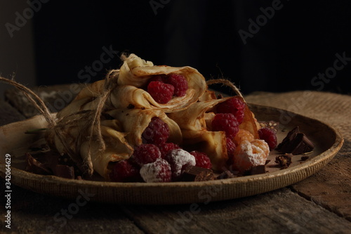 delicious pancakes on a black background in rustic style