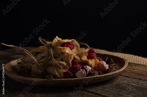 delicious pancakes on a black background in rustic style