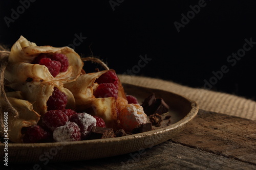 delicious pancakes on a black background in rustic style