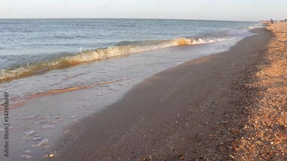 Quiet gentle wave on a sandy beach. Quiet gentle wave on a sandy beach.
