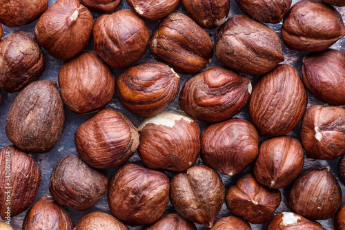 Hazelnut Background. Heap of peeled hazelnuts. Healthy snack, vegetarian food, beer snack