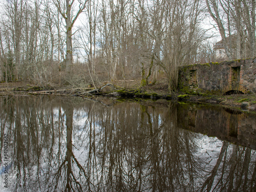 early spring landscape, tree silhouettes on the river bank photo