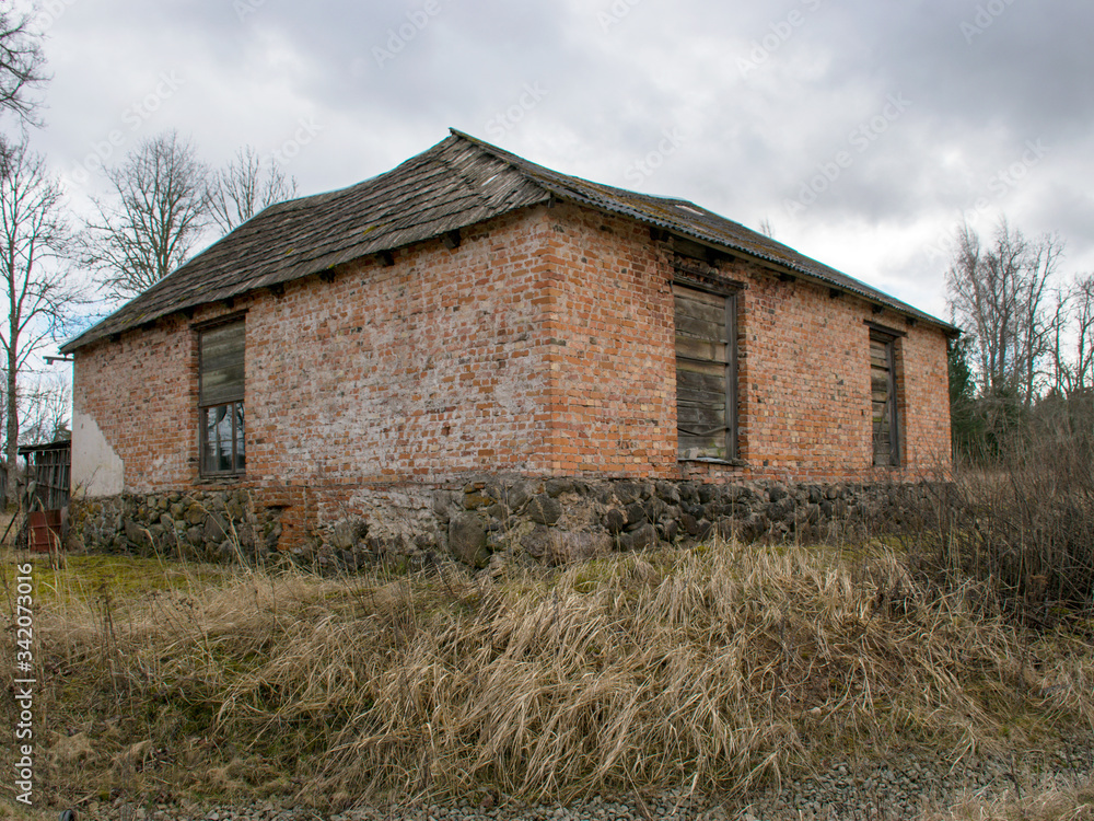 landscape with the ruins and details of an old red brick house landscape with the ruins and details of an old red brick house