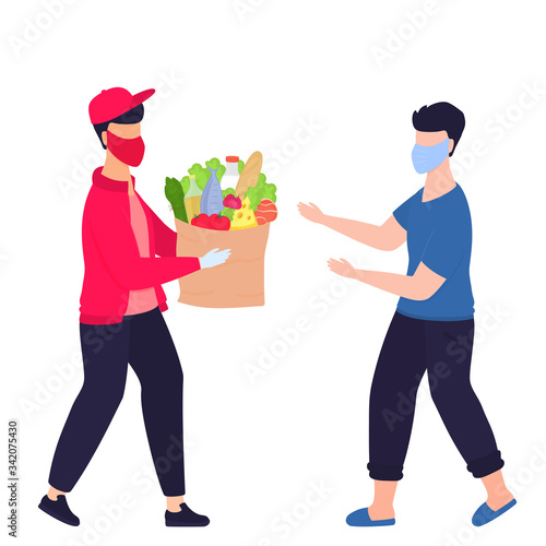 COVID-19. Coronavirus. A deliveryman in a protective medical mask brought the parcel with food. A man meets a courier. Safe delivery. Quarantine. Self isolation
