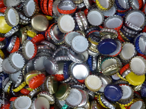 Many old, used bottle caps made of metal 