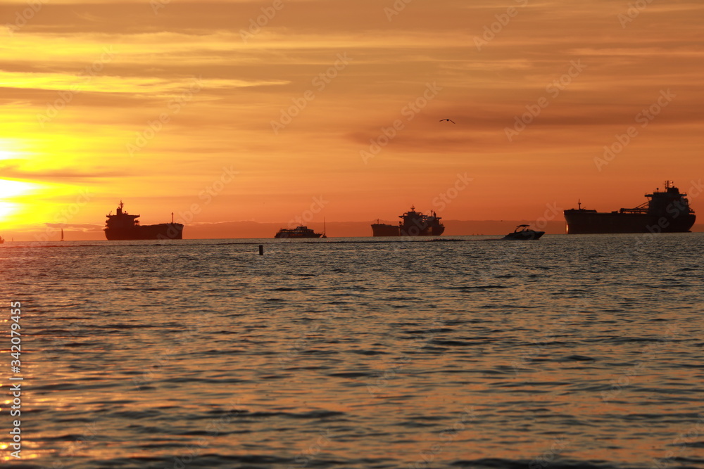 Ocean and ships during sunset
