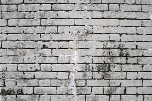 Dirty vintage brick gray grey white wall with smudges