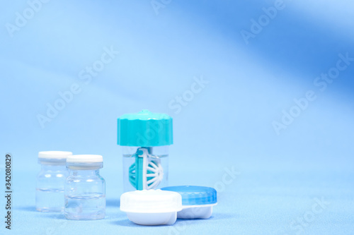 Contact lens case. Close-up of the contact lens disinfection container with cleaning solution. space for text, selective focus