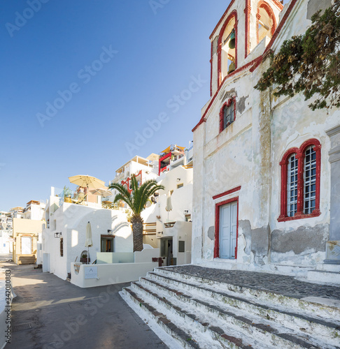 Tableau sur toile Fira typical street and church, Santorini island, Cyclades, Greece