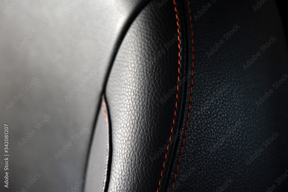 Detail of black and red line leather luxury car seat. Soft focus for texture background. Detail of black and red line leather luxury car seat. Soft focus for texture background.