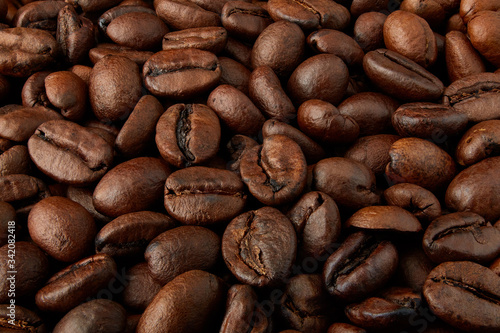 Coffee beans background close-up. Background of roasted coffee beans