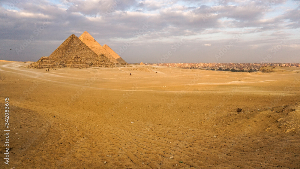 Pyramids of Giza with Giza city view background