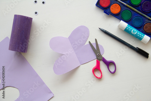 How to make batterfly from paper or toilet roll tube. Step 5 A terrible craft. School and kindergarten. Handcraft creative idea, seasonal spring time holiday pattern. How to captivate children at home © Diana