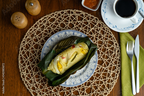Potato tamales served with coffee and chili sauce