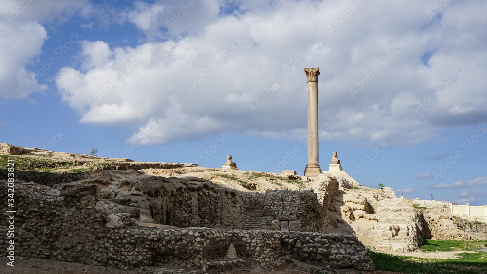Alexandria Egypt Pompey's Pillar far view with cloudy blue sky