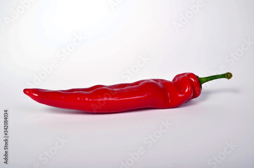 Red paprika isolated on white background. Long sweet red peppers