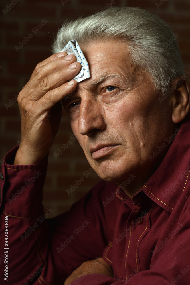 Portrait of thoughtful senior man at home Portrait of thoughtful senior man at home
