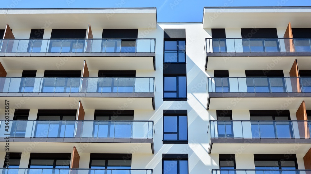 Modern condo building with big windows and modern facade. Modern condo building with big windows and modern facade.