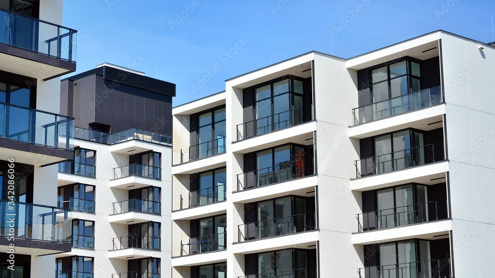 Modern condo building with big windows and modern facade.