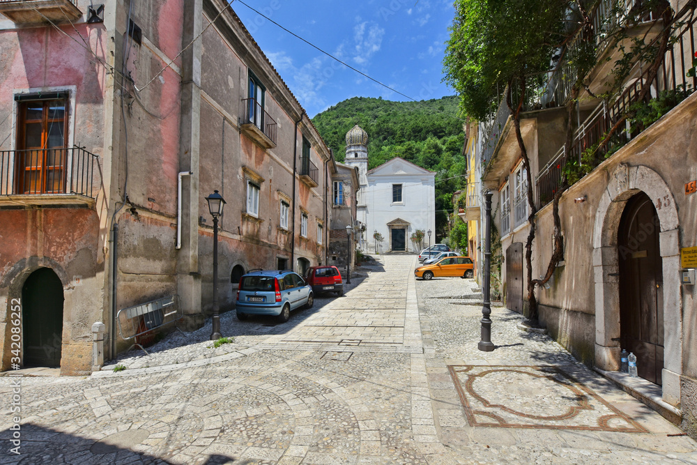 A narrow street between the old houses of a village in the province of Benevento, Italy