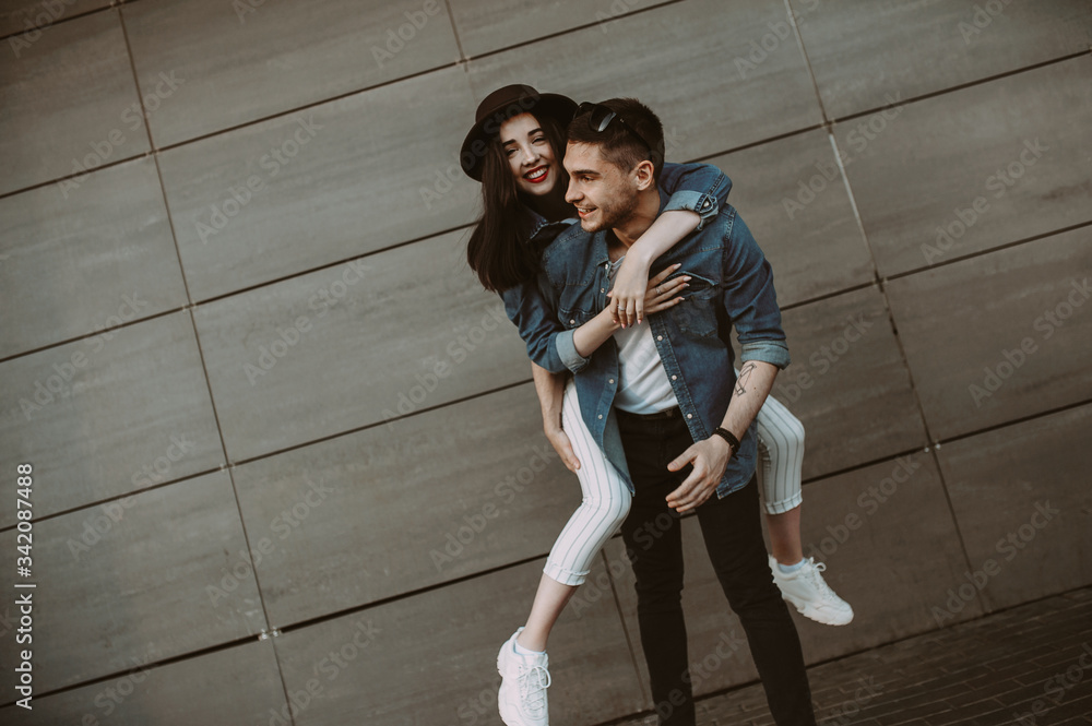 Beautiful and stylish guy and girl are having fun in the park. smiling and having fun Beautiful and stylish guy and girl are having fun in the park. smiling and having fun