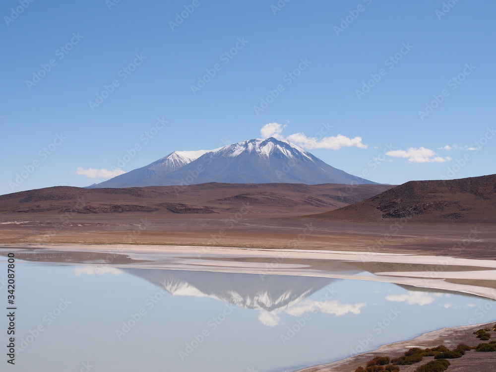 Laguna, mountains and salt lake, Altiplano, Bolivia. Copy space for text