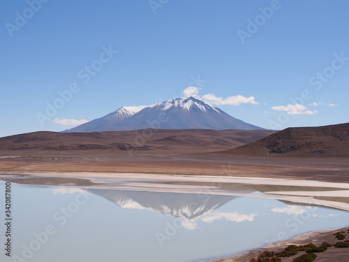 Laguna, mountains and salt lake, Altiplano, Bolivia. Copy space for text