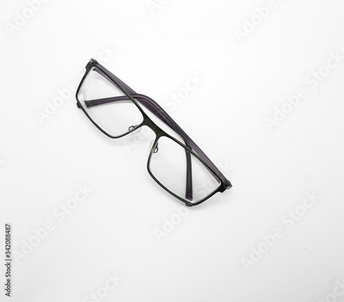 Eyeglasses for short-sighted people with water cleaner on white background