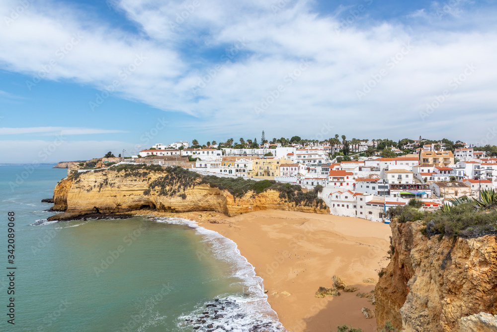 view to village and beach of Carvoeiro with scenic beach in Portugal view to village and beach of Carvoeiro with scenic beach in Portugal
