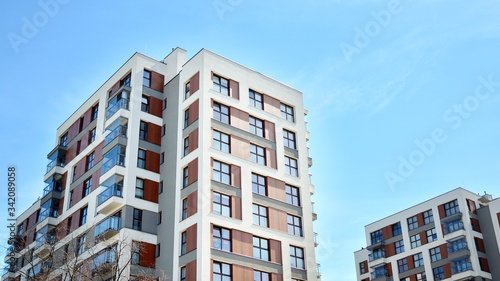 Modern condo building with big windows and modern facade.