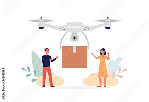 People receiving cardboard package box from delivery drone