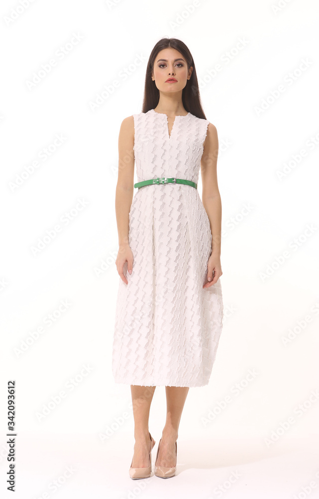 Indian business woman executive posing in long brown sleeveless summer dress full body length isolated on white Indian business woman executive posing in long brown sleeveless summer dress full body length isolated on white