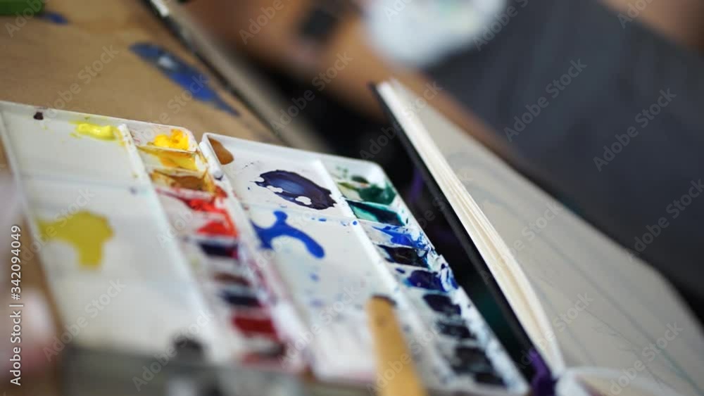 Palette, Plastic box with watercolors on the artist's desk. Drawing and creativity. School of Arts. Palette, Plastic box with watercolors on the artist's desk. Drawing and creativity. School of Arts.