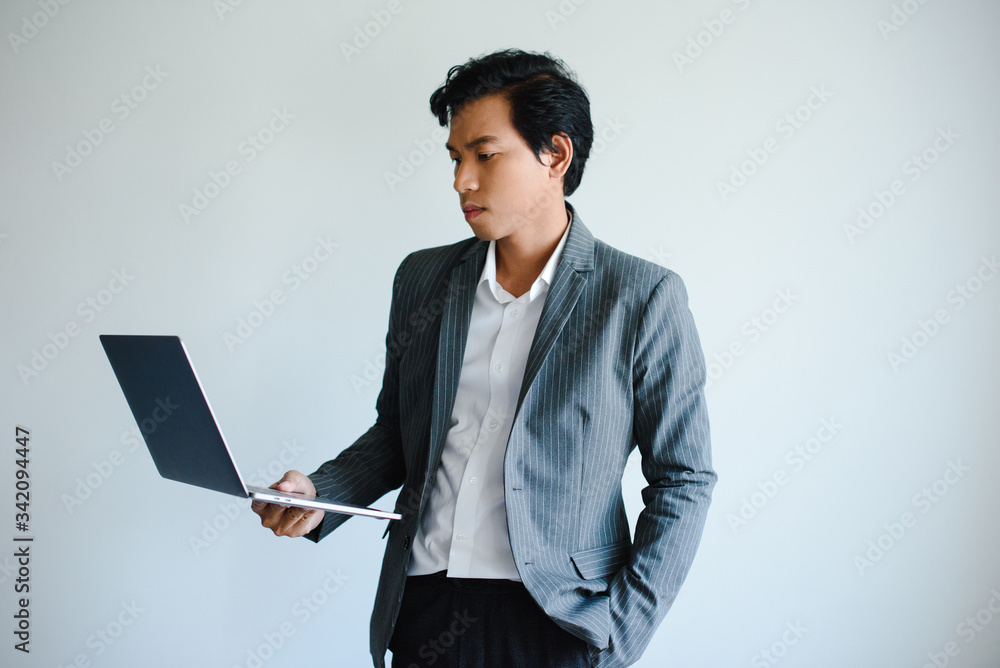 Asia Men Business person Think Working Laptop WFH Gray Background Asia Men Business person Think Working Laptop WFH Gray Background