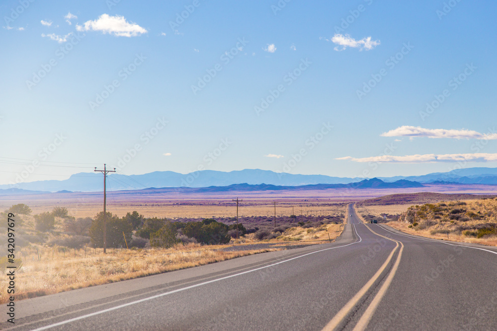 A Lonely Long Road with a Stunning Scenic Landscape View A Lonely Long Road with a Stunning Scenic Landscape View