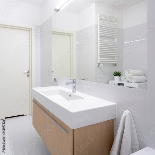 Simple bathroom with long washbasin