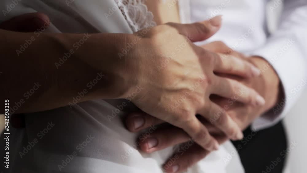 Beautiful female and male hands stroking each other, close-up Beautiful female and male hands stroking each other, close-up