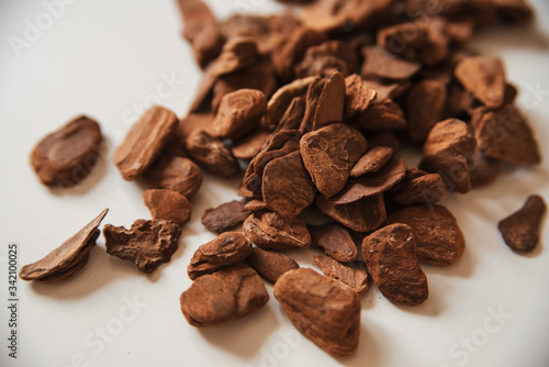 Granulated pine bark of medium fraction for planting Phalaenopsis Orchid close up on a white background photo