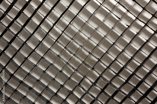 Abstract industrial background from square cells, mesh.